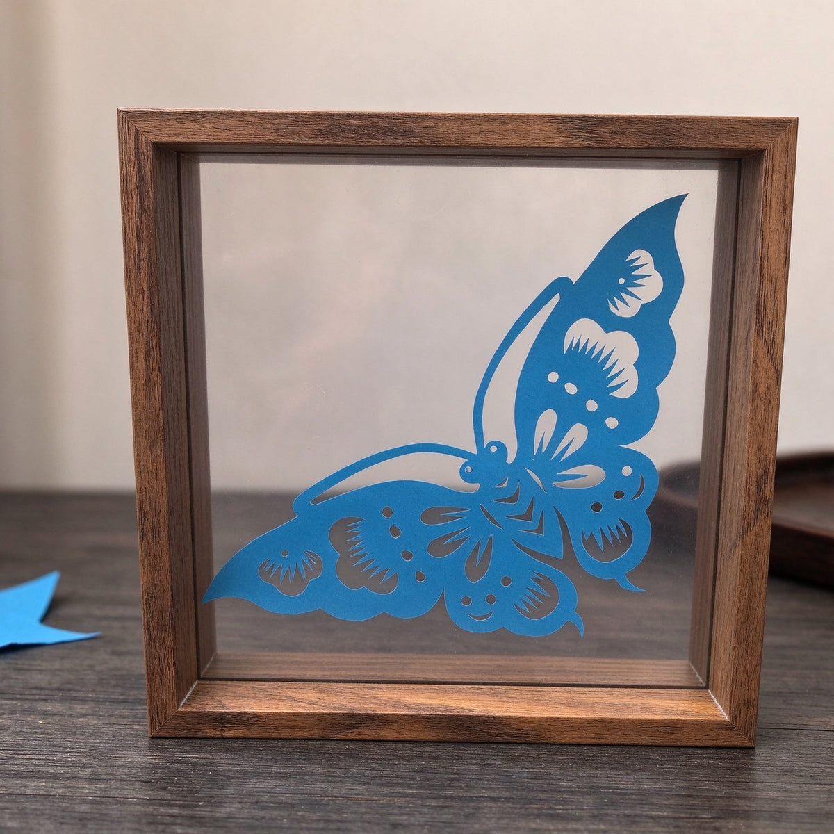 Framed Blue Butterfly Paper Cutting — Hand-Cut Chinese Papercut Art in Crimson Xuan Paper